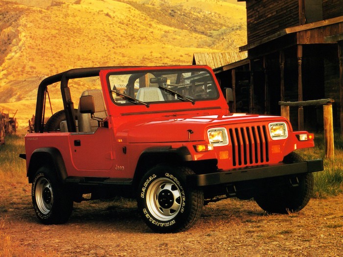 Jeep Wrangler rouge de 3/4 face